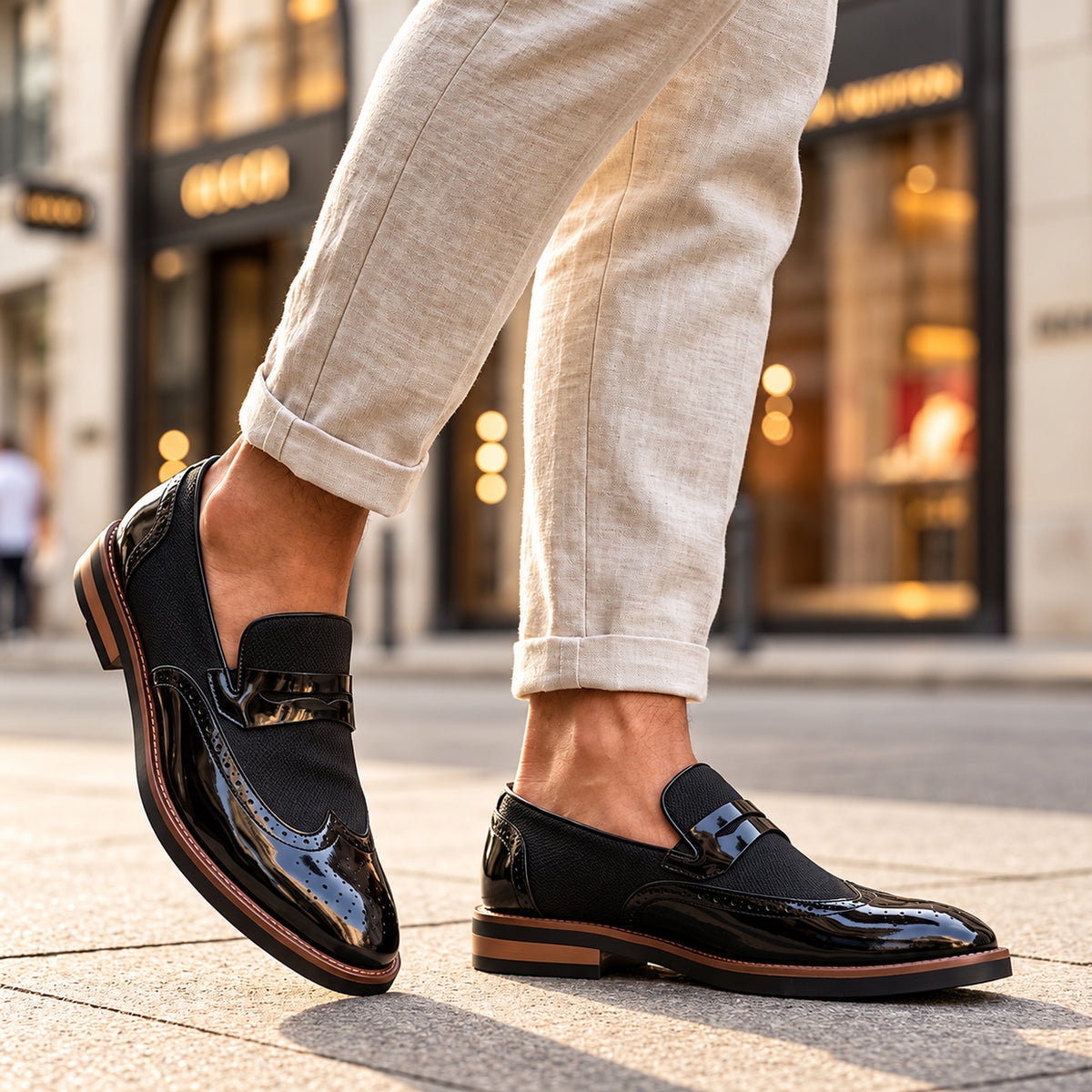 Mocassini brogue Bramwell neri indossati, vista a tre quarti